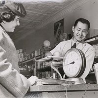 Jobu Yasumura working the counter at his family's New York City co-op, 1943.